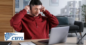 Man with headphones using a laptop.